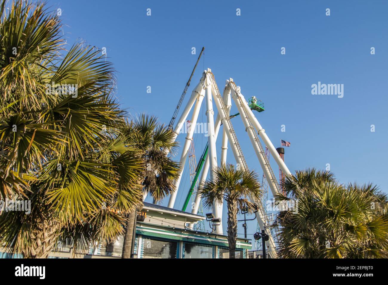 Myrtle Beach, South Carolina, USA- February 25, 2021`: Workers complete maintenance on the Myrtle Beach Sky Wheel. Stock Photo